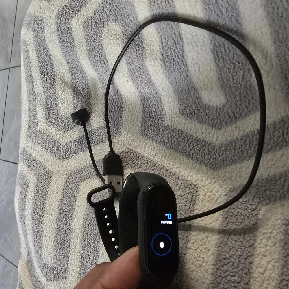 Smart Fitness Tracker with Black Band W/Charge Cable.